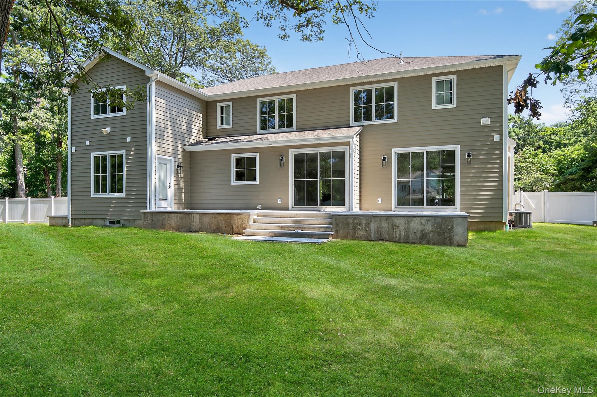654 Caledonia Road Dix Hills, NY 11746 - Photo 37 of 42 Back of property with a patio area