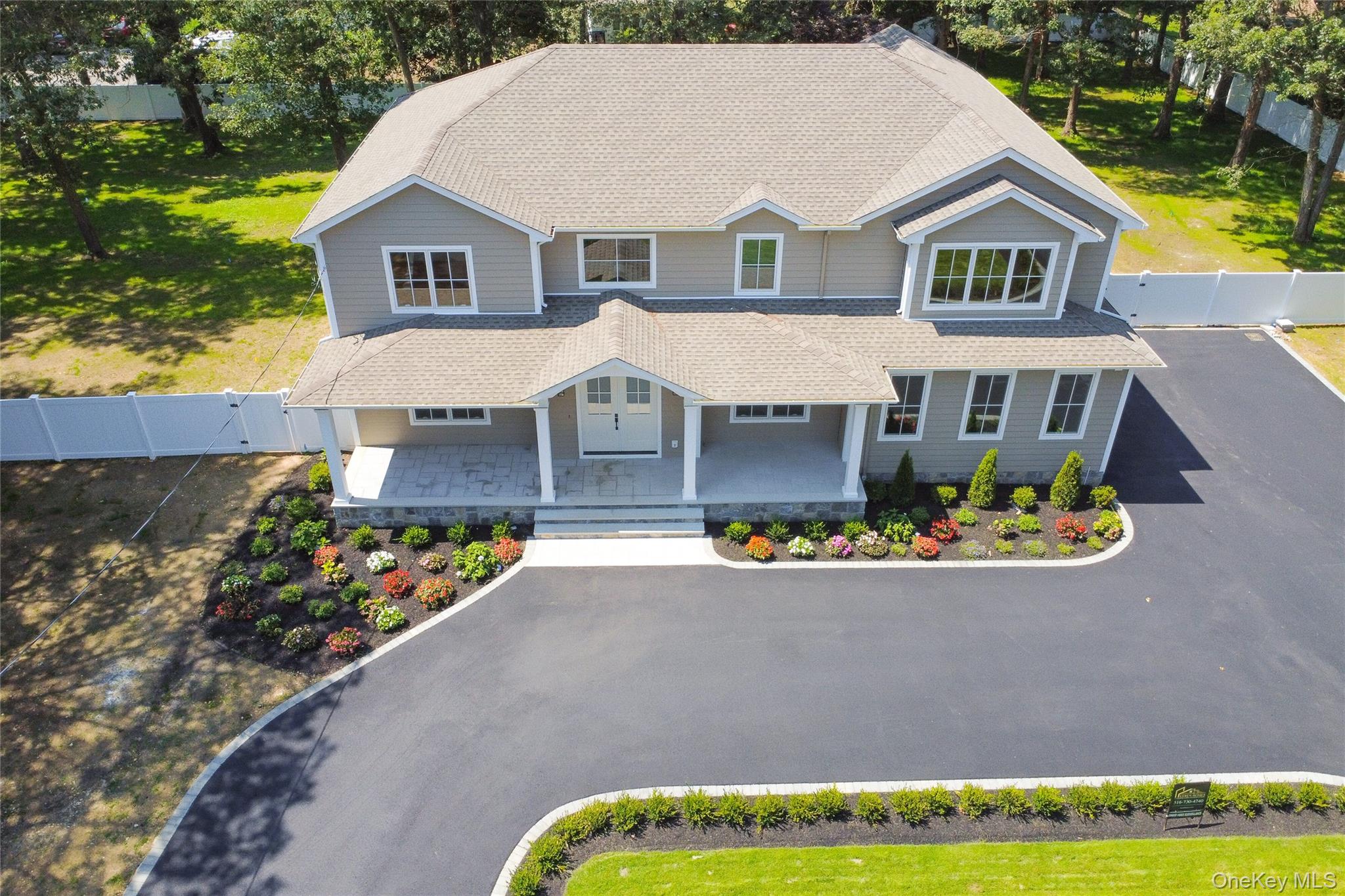654 Caledonia Road Dix Hills, NY 11746 - Photo 40 of 42 View of front of property with covered porch, a gate, and roof with shingles