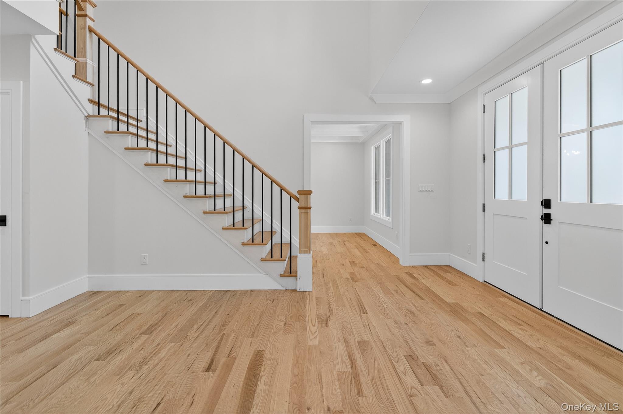 654 Caledonia Road Dix Hills, NY 11746 - Photo 5 of 42 Entryway featuring stairs, light wood finished floors, and recessed lighting