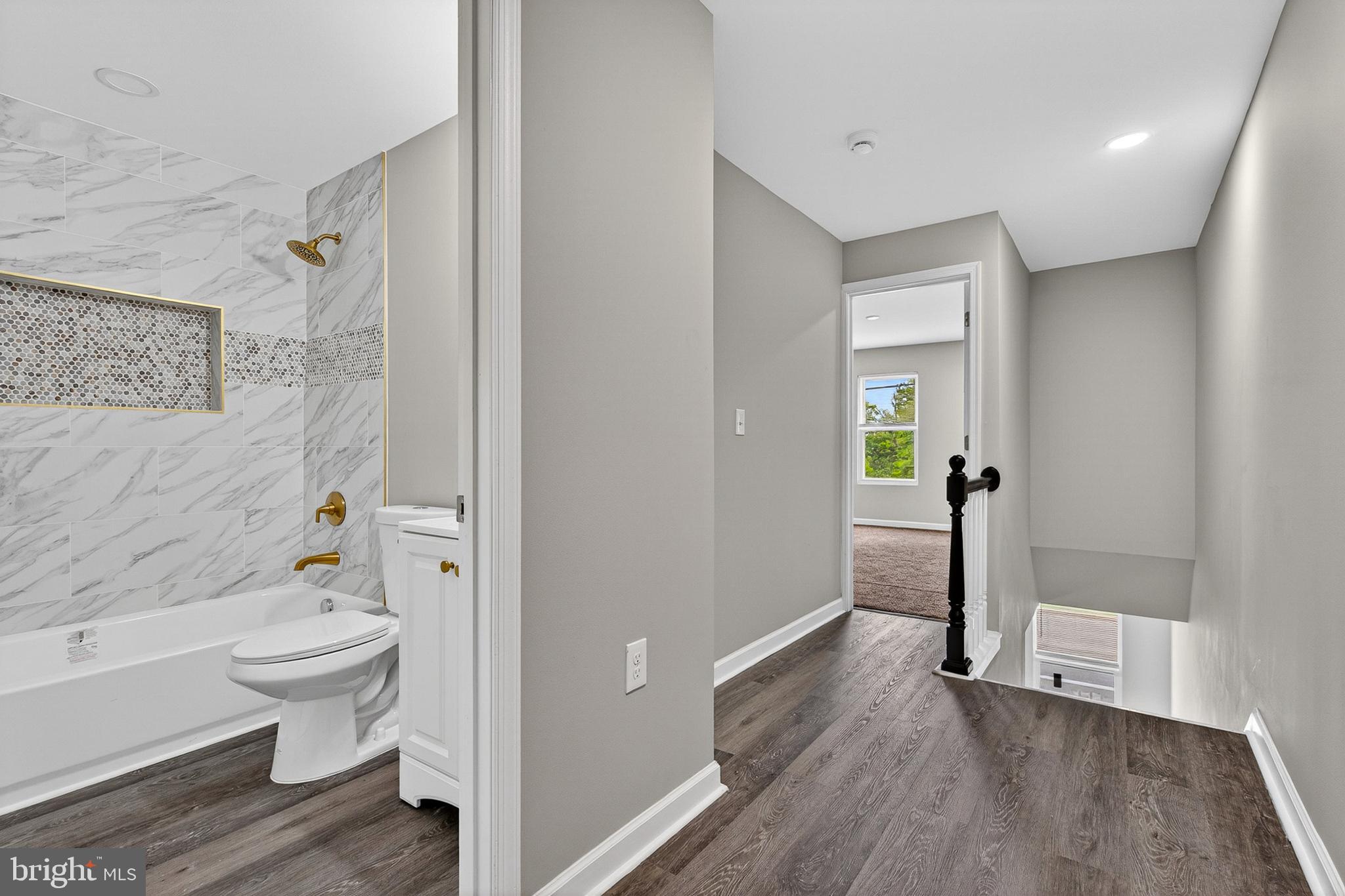 3708 Old Frederick Road Baltimore, MD 21229 - Photo 11 of 26 a bathroom with a toilet and a shower