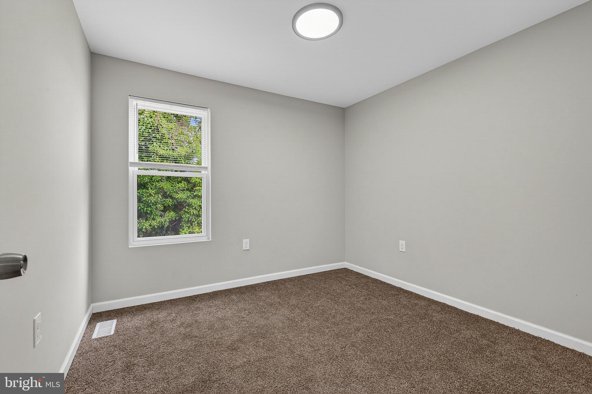 3708 Old Frederick Road Baltimore, MD 21229 - Photo 17 of 26 an empty room with a window