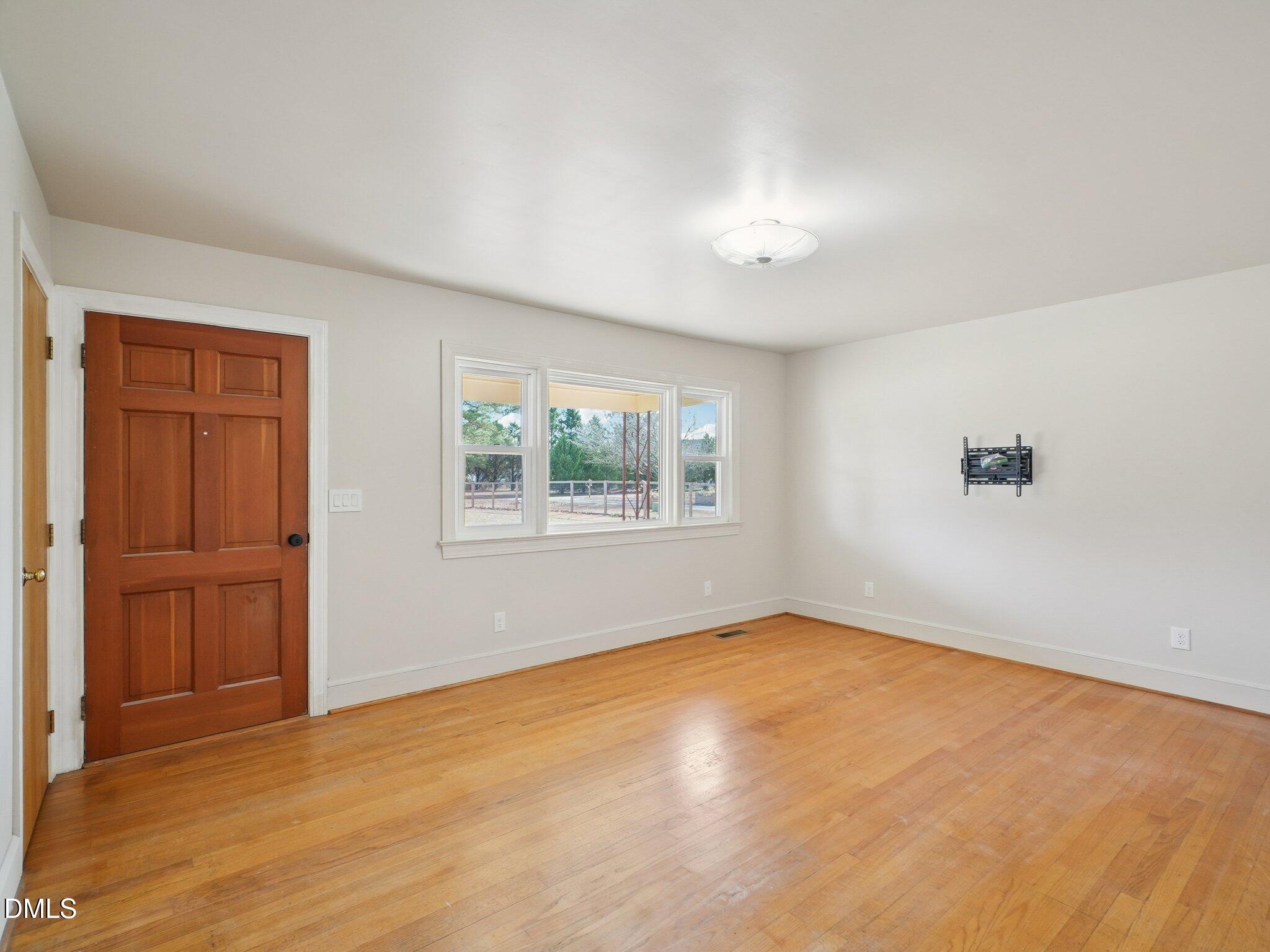 5474 Deans Road Battleboro, NC 27809 - Photo 11 of 32 an empty room with windows and closet