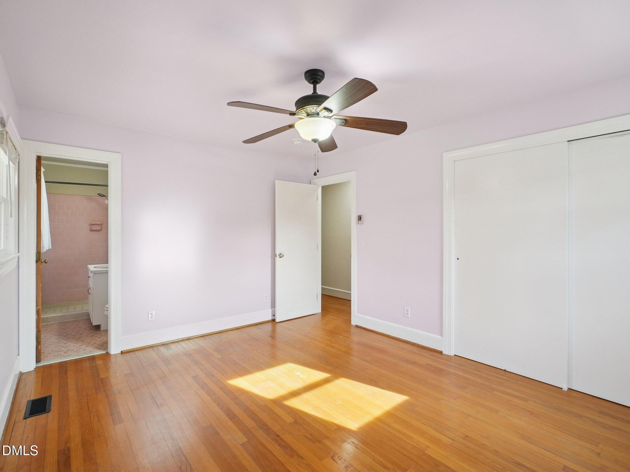 5474 Deans Road Battleboro, NC 27809 - Photo 19 of 32 a very nice looking hallway with a chandelier fan
