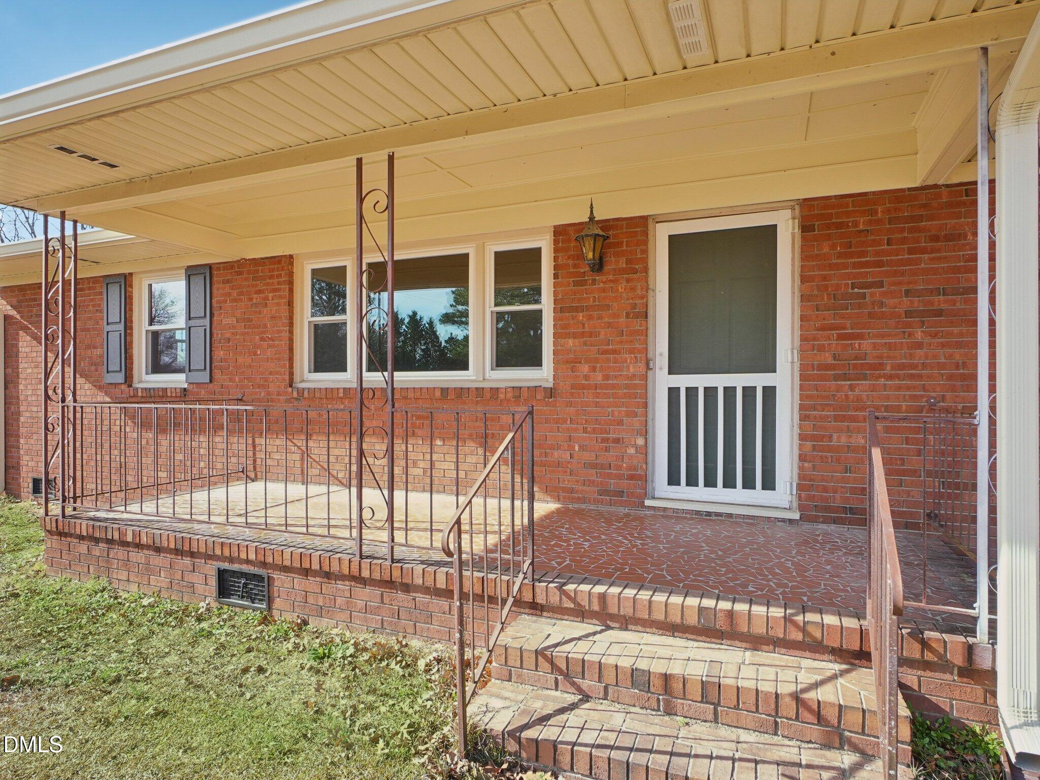 5474 Deans Road Battleboro, NC 27809 - Photo 2 of 32 a front view of a house with a garden