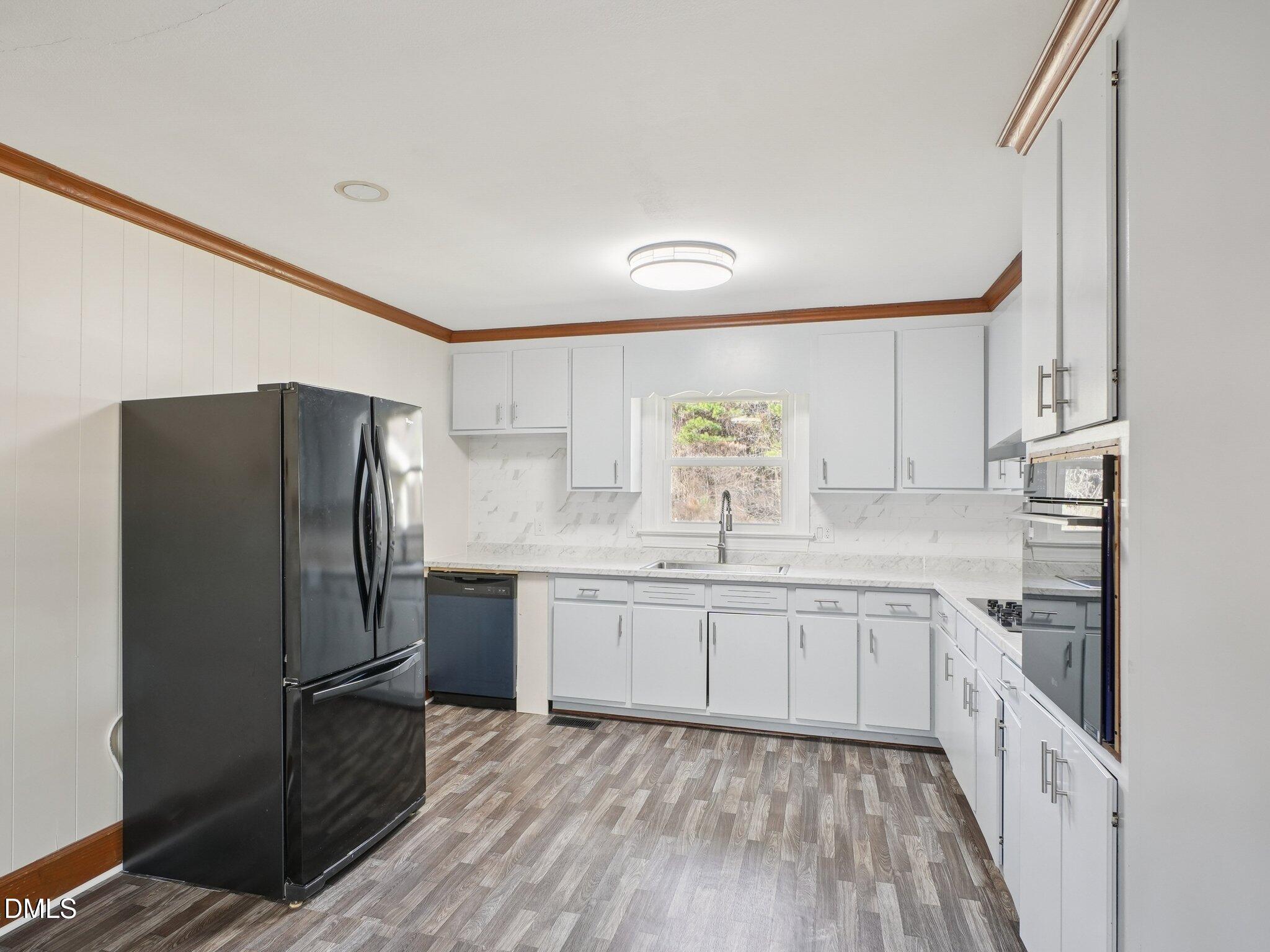 5474 Deans Road Battleboro, NC 27809 - Photo 8 of 32 a kitchen with stainless steel appliances a refrigerator sink and microwave