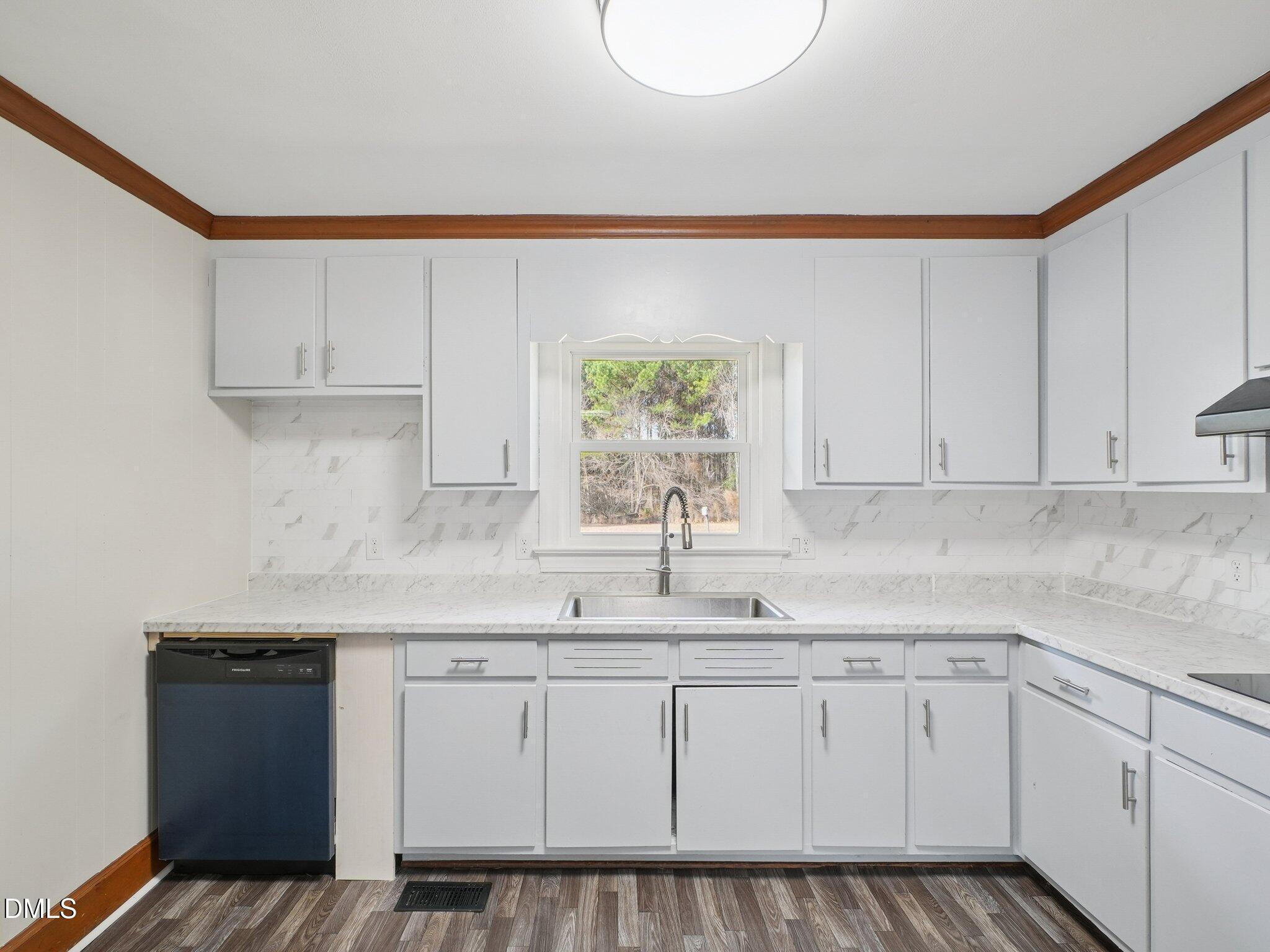 5474 Deans Road Battleboro, NC 27809 - Photo 10 of 32 a kitchen with a sink cabinets and window