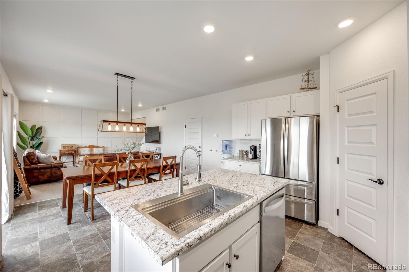 4811 River Highlands Loop Elizabeth, CO 80107 - Photo 13 of 37 a kitchen with stainless steel appliances granite countertop a sink a stove and a refrigerator