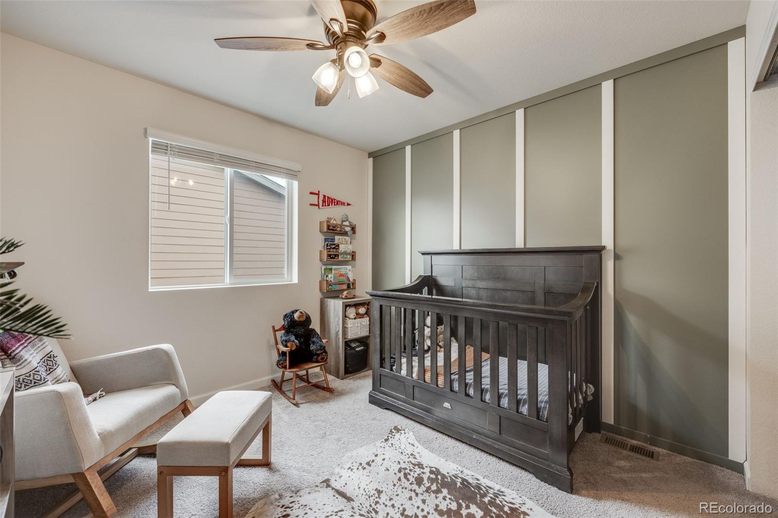 4811 River Highlands Loop Elizabeth, CO 80107 - Photo 23 of 37 a view of a room with furniture window and wooden floor