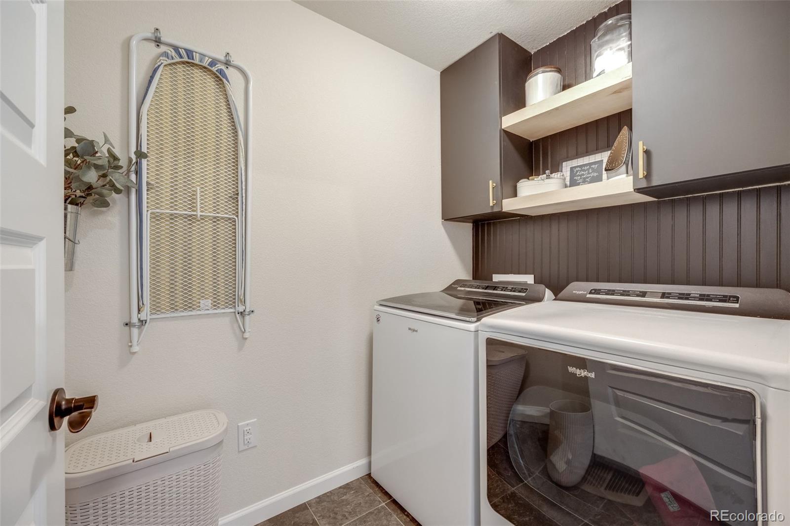 4811 River Highlands Loop Elizabeth, CO 80107 - Photo 26 of 37 a utility room with dryer and washer