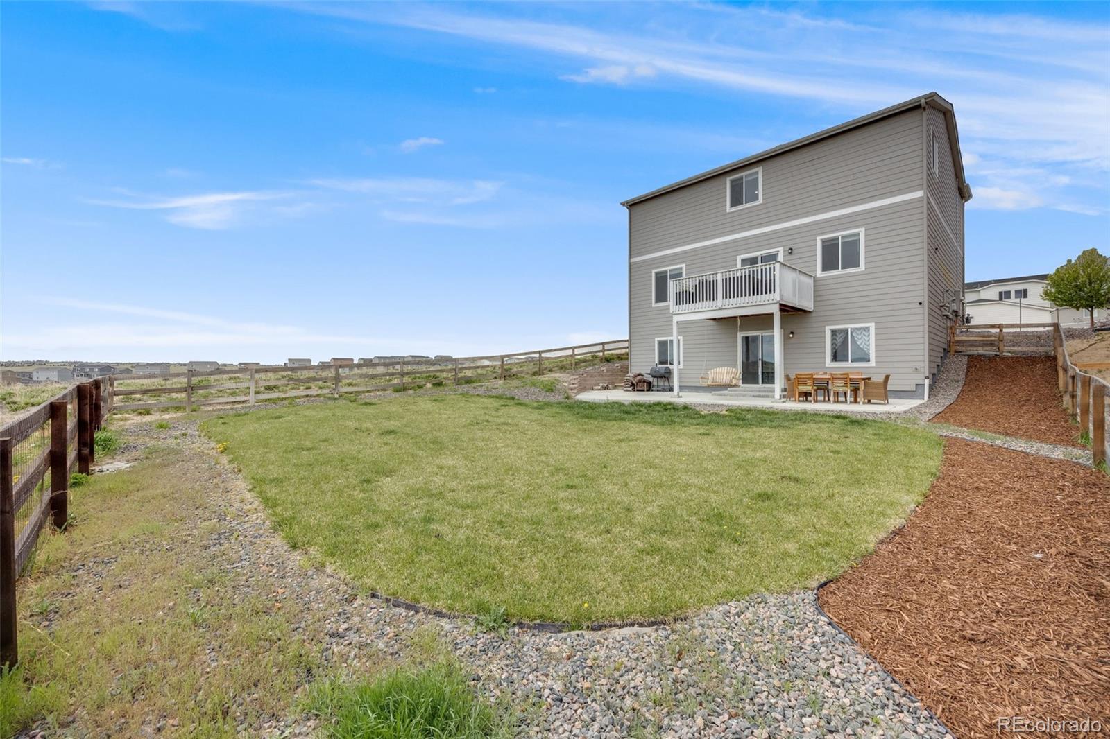 4811 River Highlands Loop Elizabeth, CO 80107 - Photo 29 of 37 a view of a water fountain in front of a house