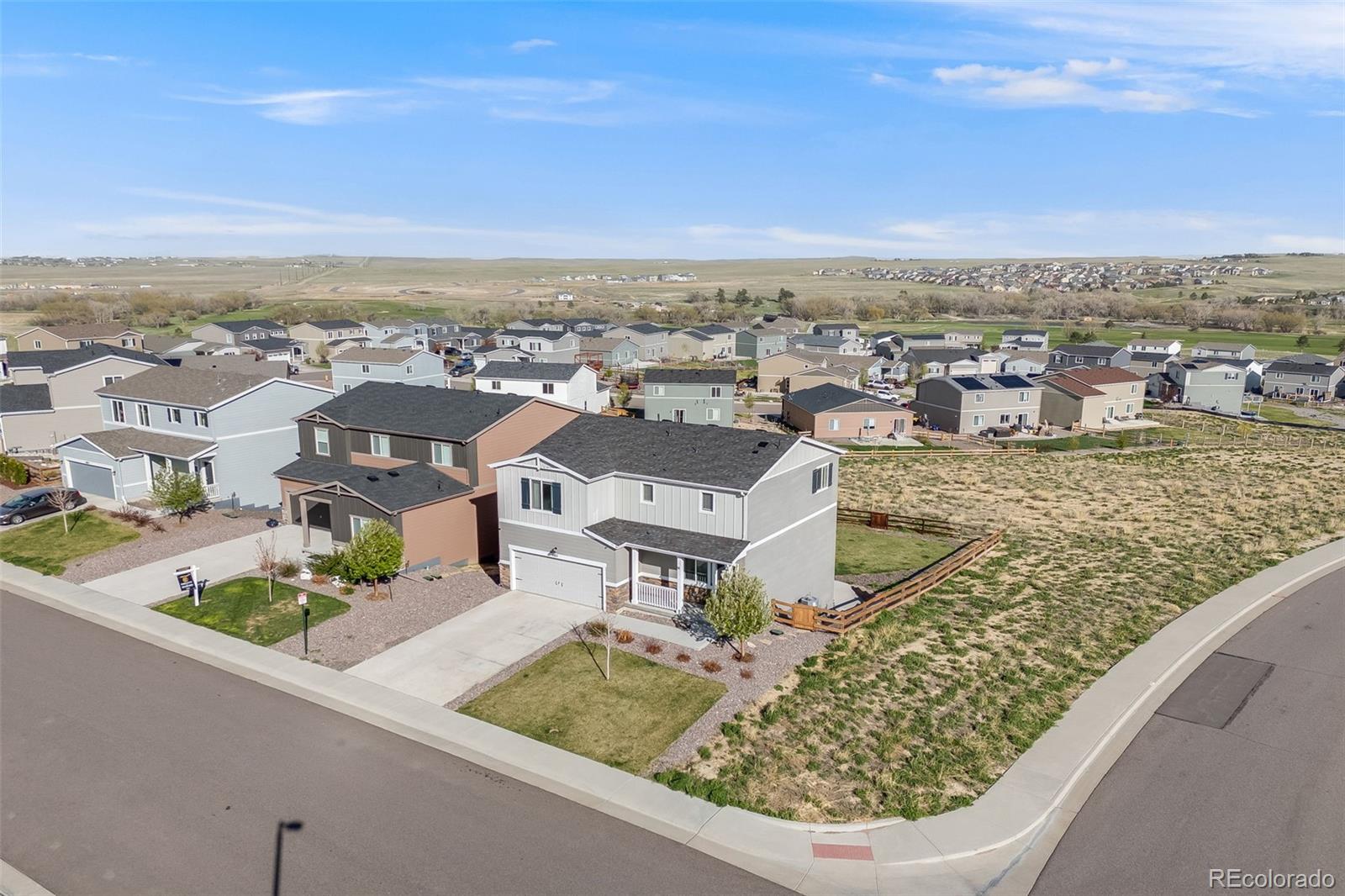 4811 River Highlands Loop Elizabeth, CO 80107 - Photo 32 of 37 an aerial view of a house with a garden