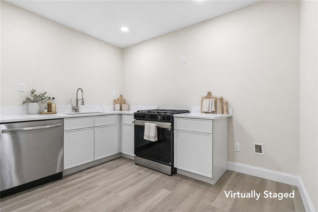 2927 Ponderosa Circle Decatur, GA 30033 - Photo 15 of 27 a kitchen with a white cabinets and white appliances