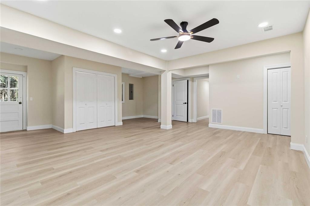 2927 Ponderosa Circle Decatur, GA 30033 - Photo 17 of 27 a view of an empty room with cabinet and a ceiling fan
