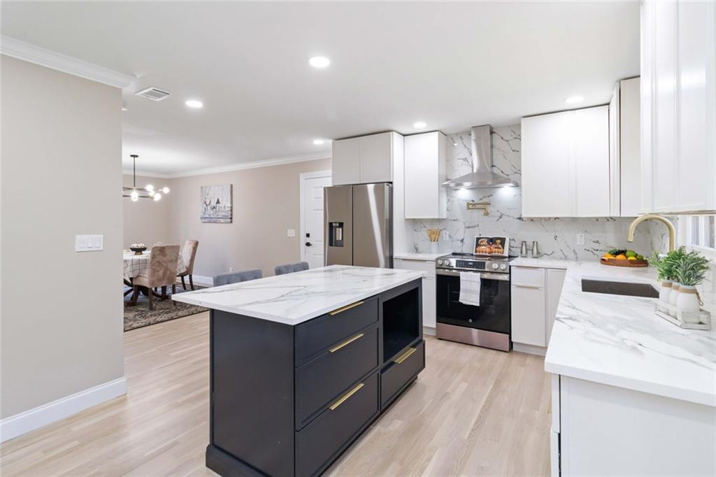 2927 Ponderosa Circle Decatur, GA 30033 - Photo 2 of 27 a kitchen with granite countertop a sink stove and refrigerator