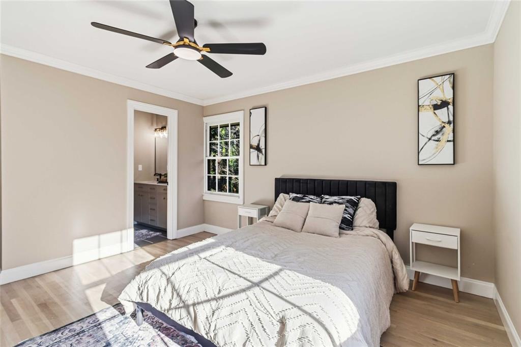 2927 Ponderosa Circle Decatur, GA 30033 - Photo 9 of 27 a bedroom with a bed and a chandelier