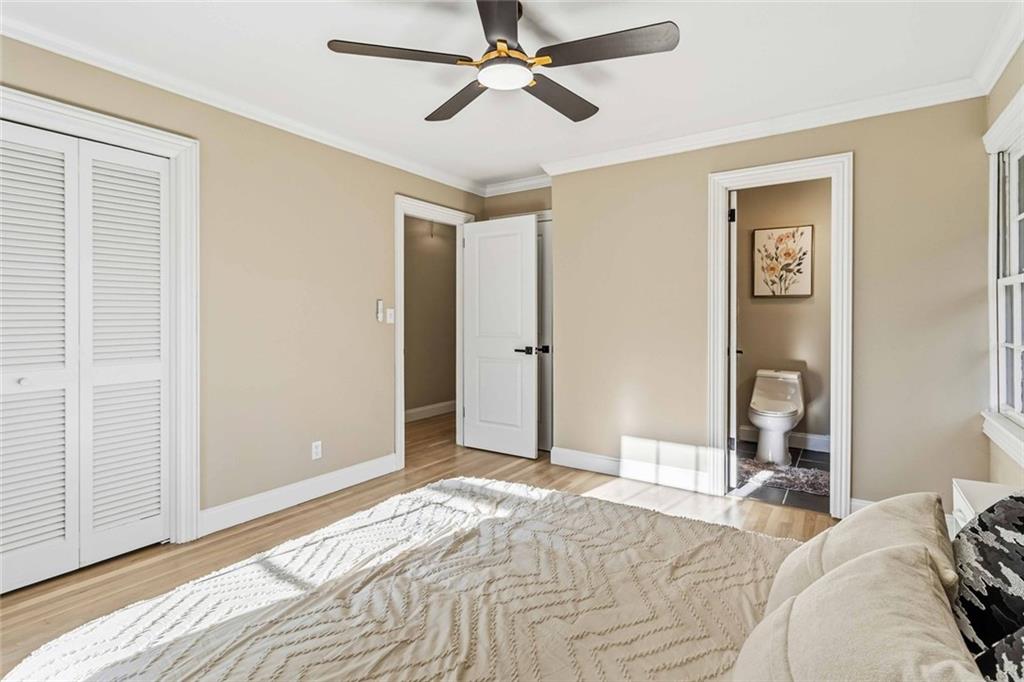 2927 Ponderosa Circle Decatur, GA 30033 - Photo 10 of 27 a bedroom with a bed and a chandelier