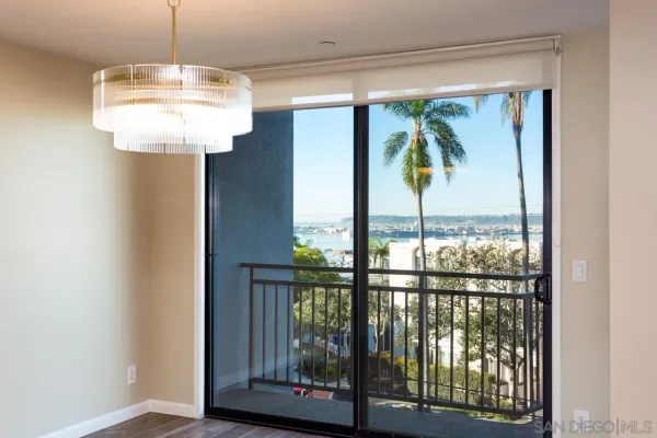 a view of a porch with a floor to ceiling window