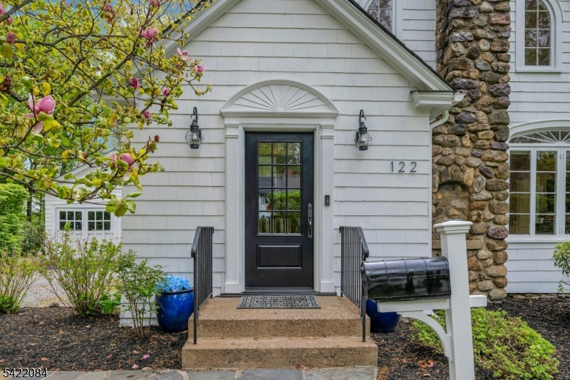 122 Kenilworth Road Mountain Lakes, NJ 07046 - Photo 13 of 45 a front view of a house with plants