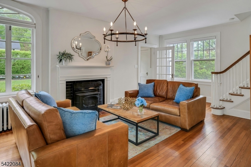 122 Kenilworth Road Mountain Lakes, NJ 07046 - Photo 15 of 45 a living room with furniture a fireplace and a large window
