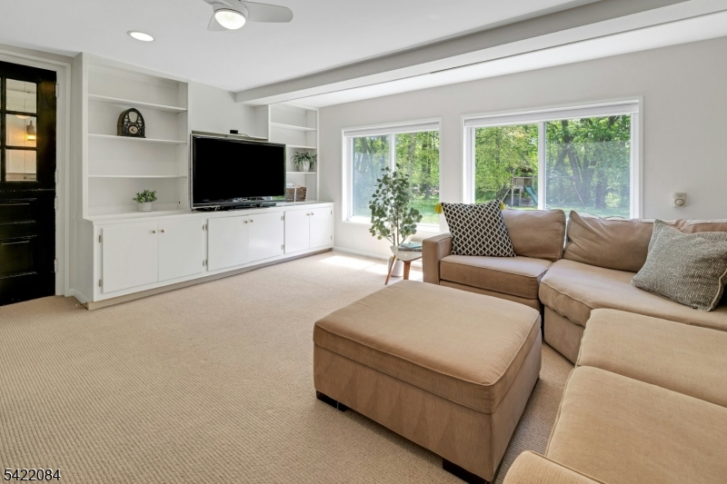 122 Kenilworth Road Mountain Lakes, NJ 07046 - Photo 28 of 45 a living room with furniture and a flat screen tv