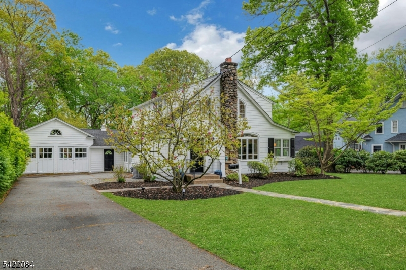 122 Kenilworth Road Mountain Lakes, NJ 07046 - Photo 3 of 45 a front view of a house with a yard and trees