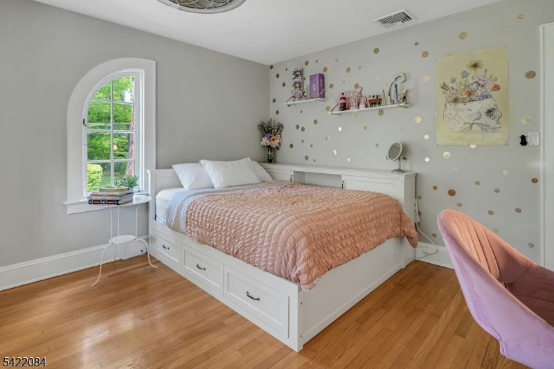 122 Kenilworth Road Mountain Lakes, NJ 07046 - Photo 35 of 45 a bedroom with a bed and a window