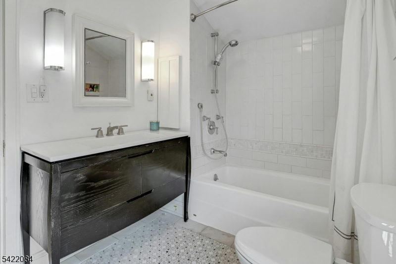 122 Kenilworth Road Mountain Lakes, NJ 07046 - Photo 38 of 45 a bathroom with a sink toilet and shower