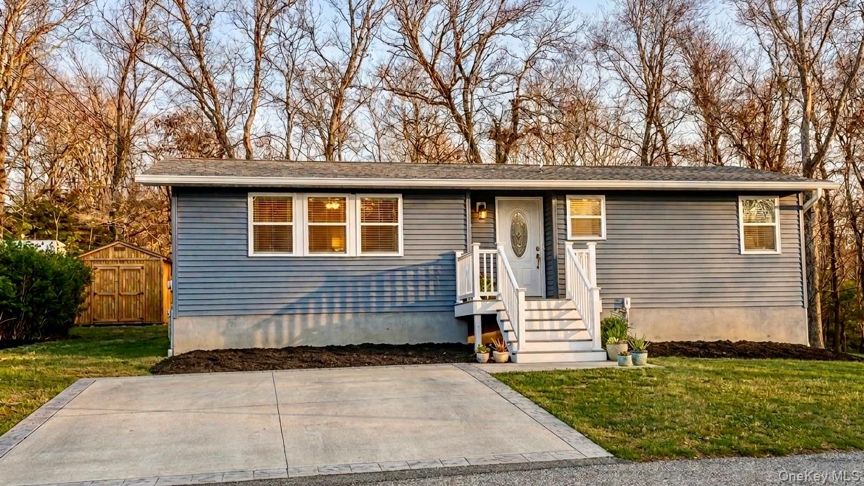 20 Walker Road Highland Falls, NY 10928 - Photo 1 of 10 Bungalow-style house with a front yard and an outdoor structure