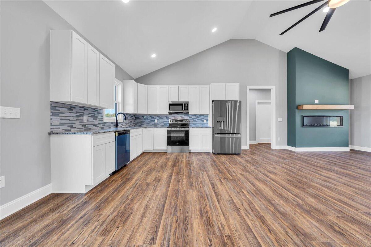 224 Marshall Mill Road Gladys, VA 24554 - Photo 11 of 38 a kitchen with stainless steel appliances a refrigerator and a stove top oven