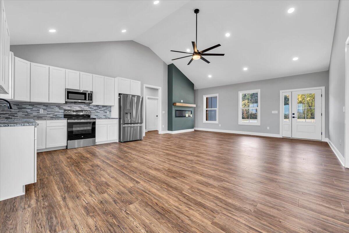 224 Marshall Mill Road Gladys, VA 24554 - Photo 12 of 38 a view of a kitchen with a stove cabinets and wooden floor