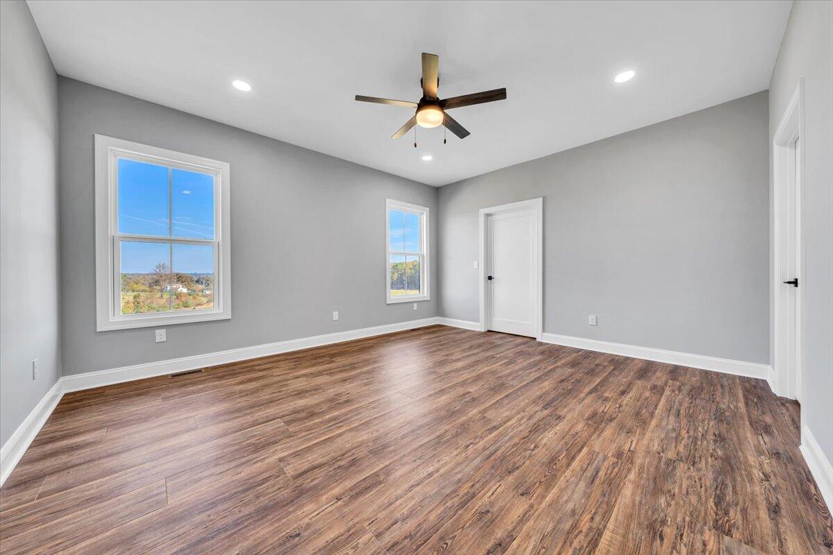 224 Marshall Mill Road Gladys, VA 24554 - Photo 14 of 38 wooden floor in an empty room with a window