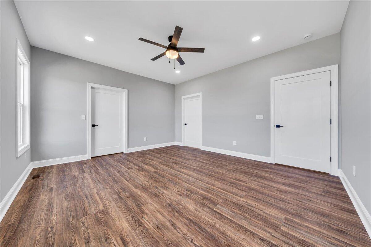 224 Marshall Mill Road Gladys, VA 24554 - Photo 15 of 38 a view of empty room with wooden floor and fan