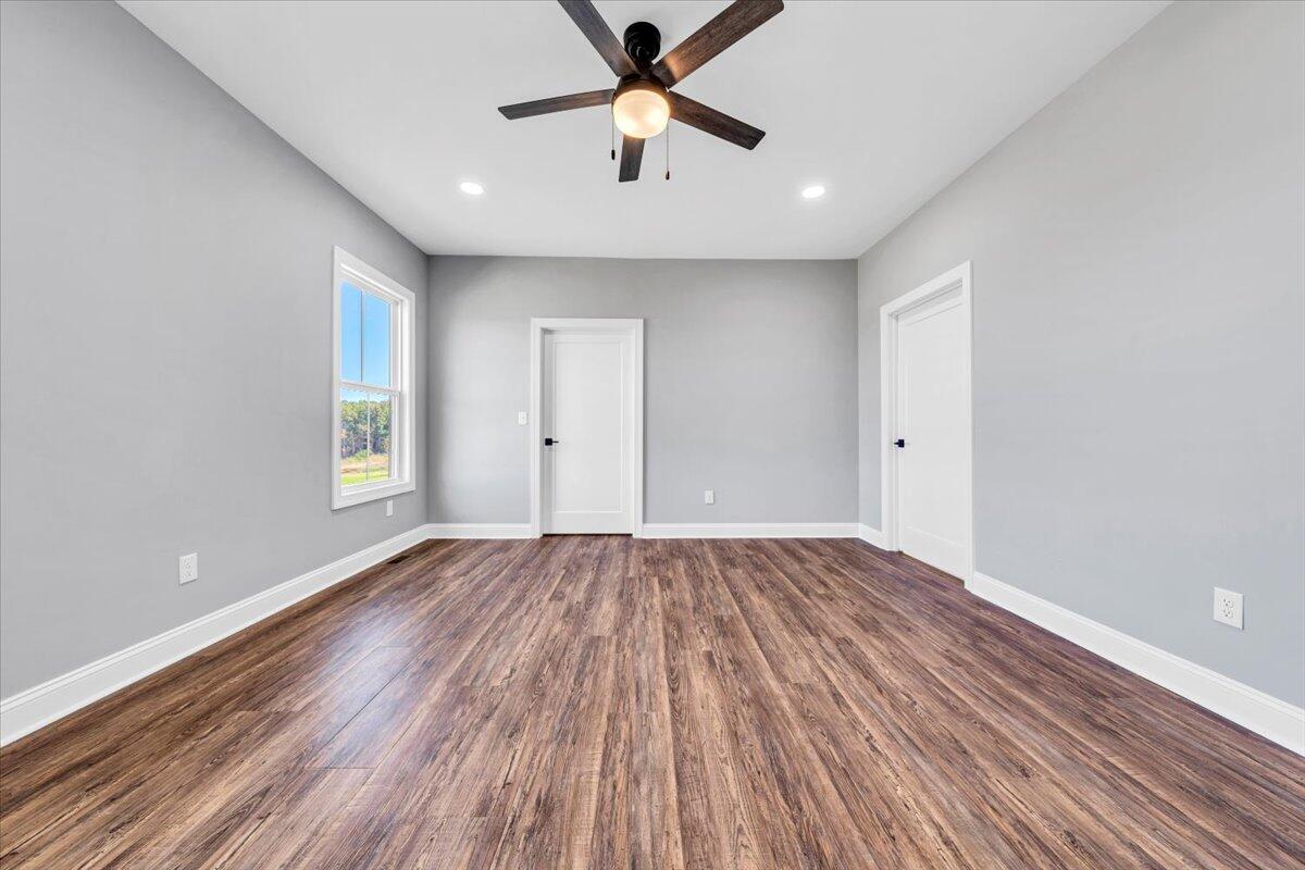 224 Marshall Mill Road Gladys, VA 24554 - Photo 16 of 38 wooden floor in an empty room with a window