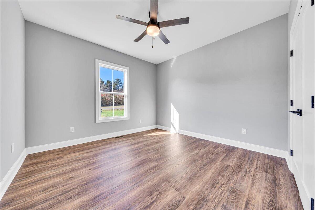 224 Marshall Mill Road Gladys, VA 24554 - Photo 22 of 38 wooden floor in an empty room with a window