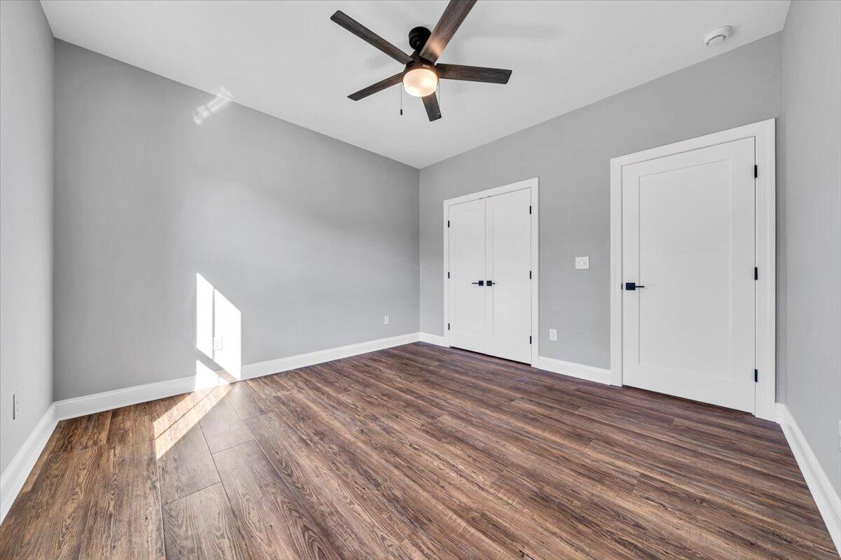224 Marshall Mill Road Gladys, VA 24554 - Photo 23 of 38 a view of empty room with wooden floor and fan