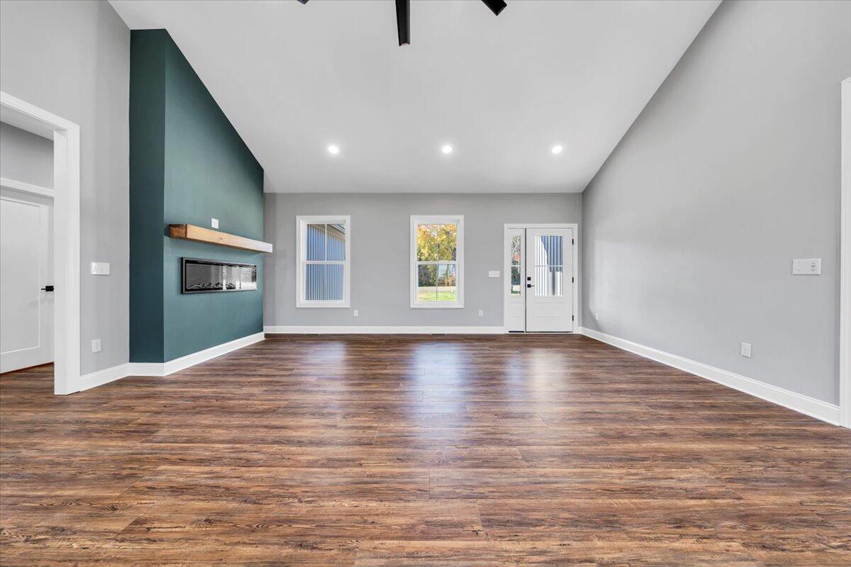 224 Marshall Mill Road Gladys, VA 24554 - Photo 7 of 38 a view of an empty room with window and wooden floor