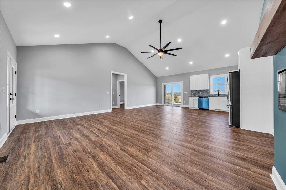 224 Marshall Mill Road Gladys, VA 24554 - Photo 9 of 38 a view of empty room with wooden floor and ceiling fan