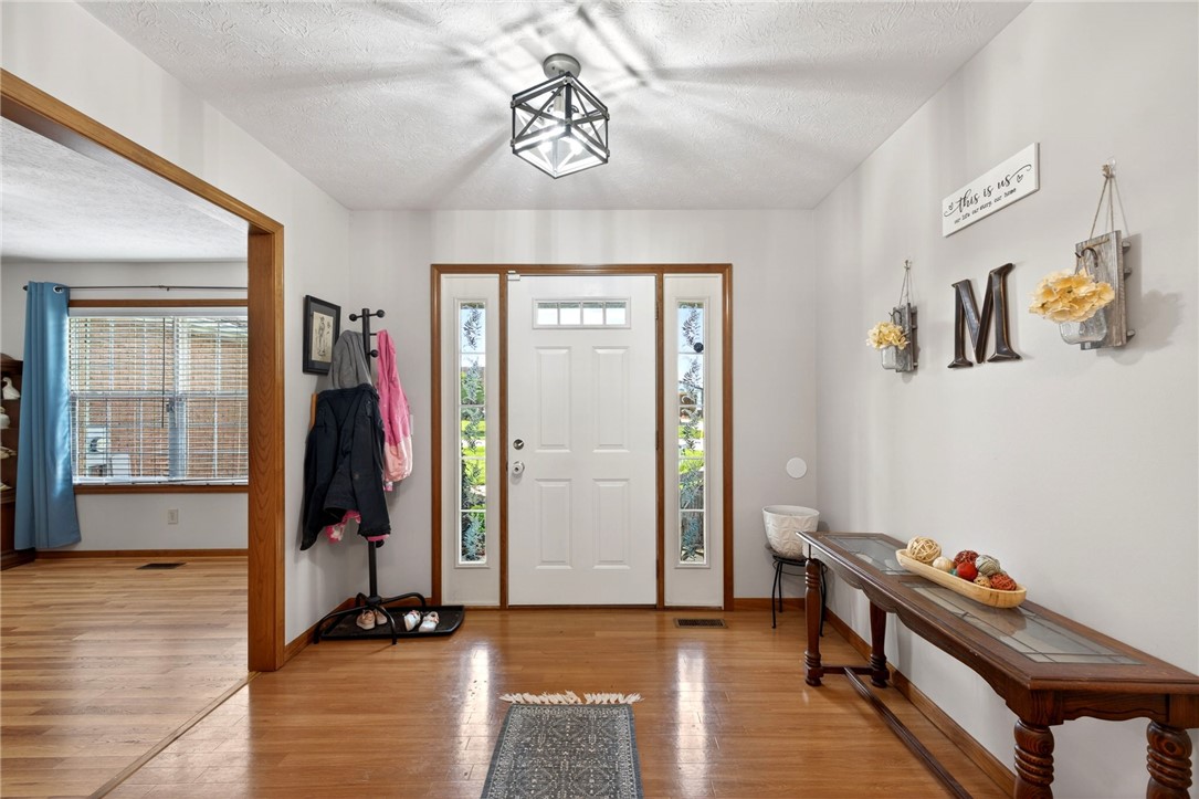 4996 Shannon Avenue Springfield, OH 45504 - Photo 14 of 61 This entry hall features durable wood flooring and ample natural light from the front door's sidelights.