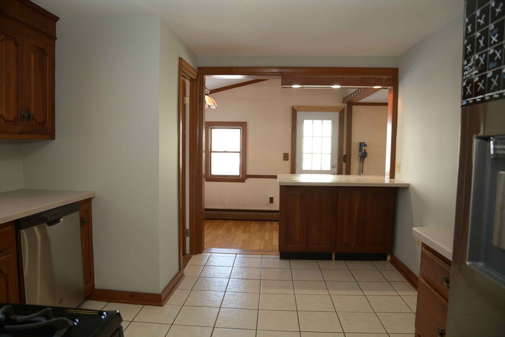 15 Highfield Road Boston, MA 02131 - Photo 17 of 41 a view of a hallway with wooden floor and a living room