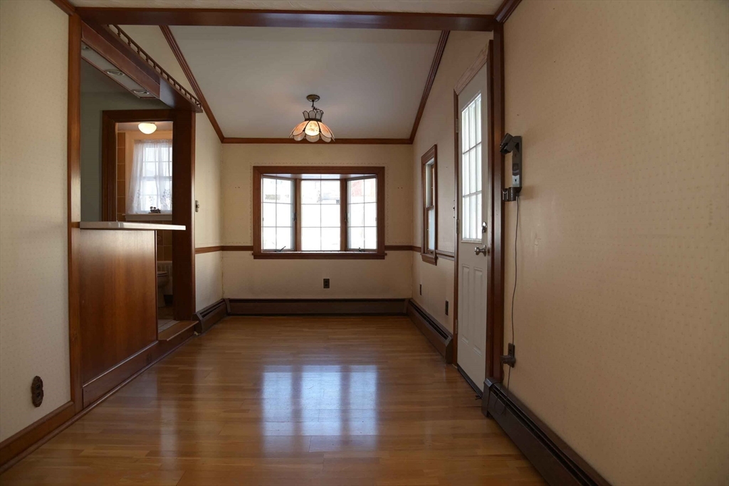 15 Highfield Road Boston, MA 02131 - Photo 19 of 41 a view of a hallway with wooden floor and a living room