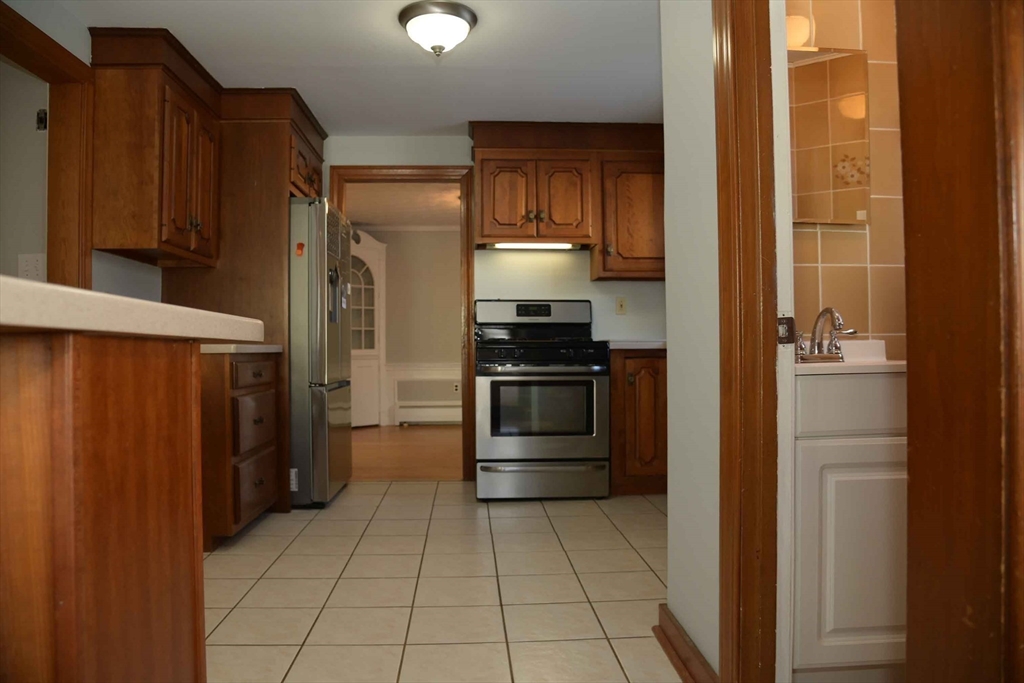 15 Highfield Road Boston, MA 02131 - Photo 20 of 41 a kitchen with a refrigerator and a stove