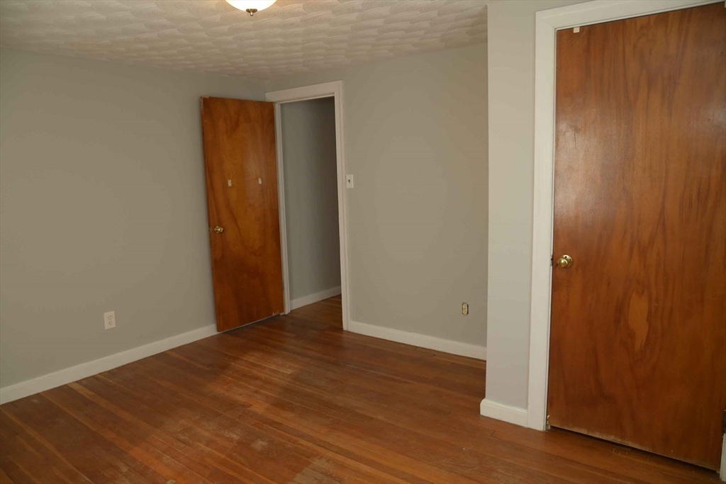 15 Highfield Road Boston, MA 02131 - Photo 29 of 41 a view of an empty room with wooden floor
