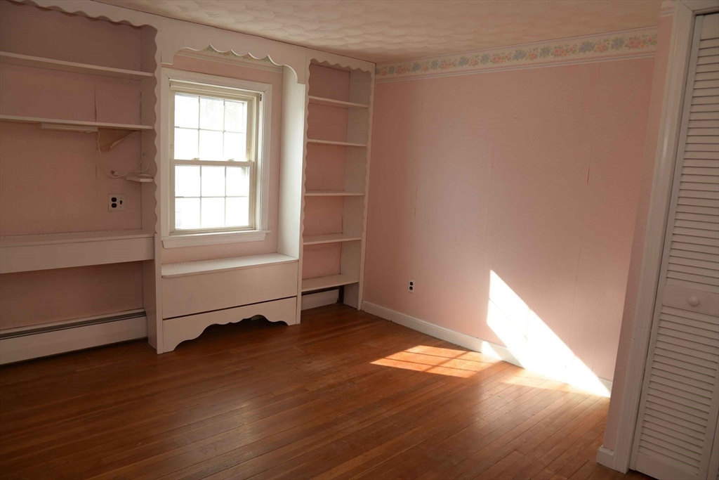 15 Highfield Road Boston, MA 02131 - Photo 33 of 41 an empty room with wooden floor and windows