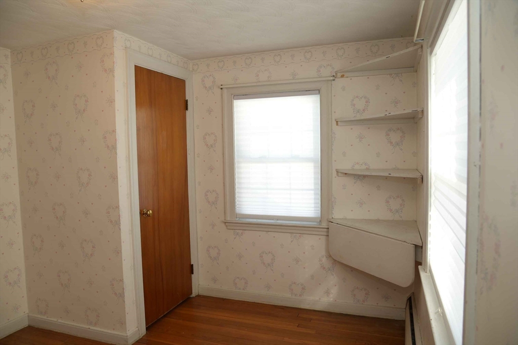 15 Highfield Road Boston, MA 02131 - Photo 35 of 41 a view of an empty room with wooden floor and a window