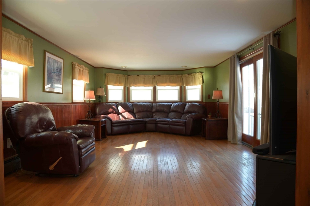 15 Highfield Road Boston, MA 02131 - Photo 8 of 41 a living room with furniture and a large window