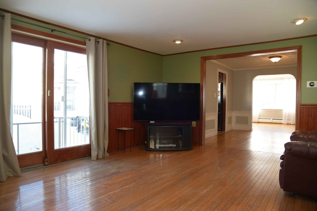 15 Highfield Road Boston, MA 02131 - Photo 9 of 41 a living room with furniture and a flat screen tv