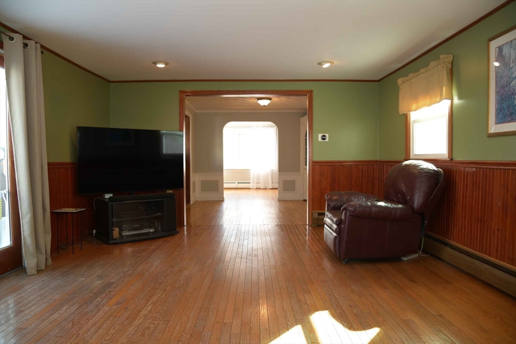 15 Highfield Road Boston, MA 02131 - Photo 10 of 41 a living room with furniture and a flat screen tv