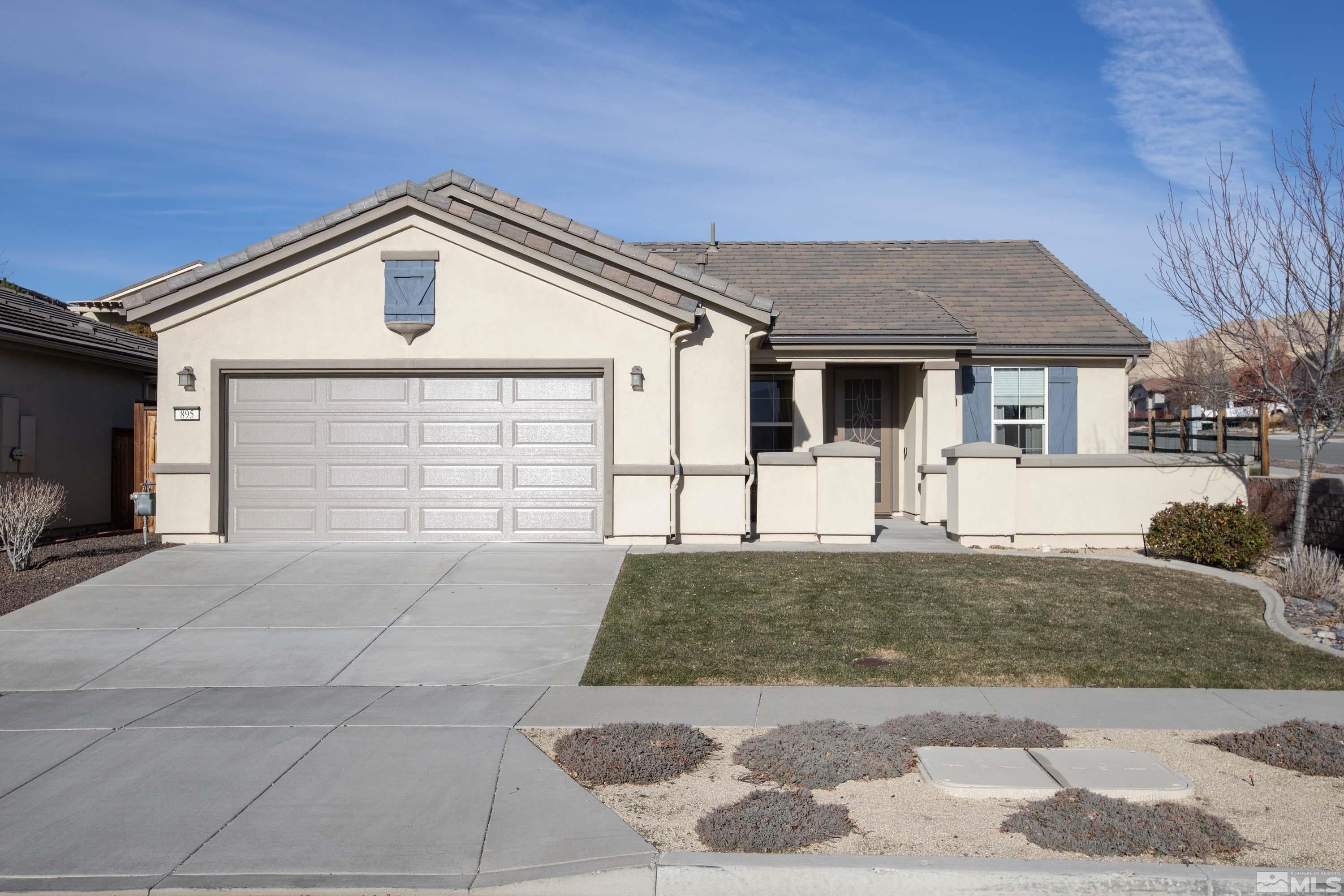 895 Larrimore Trail Reno, NV 89523 - Photo 1 of 39 a front view of a house with a yard