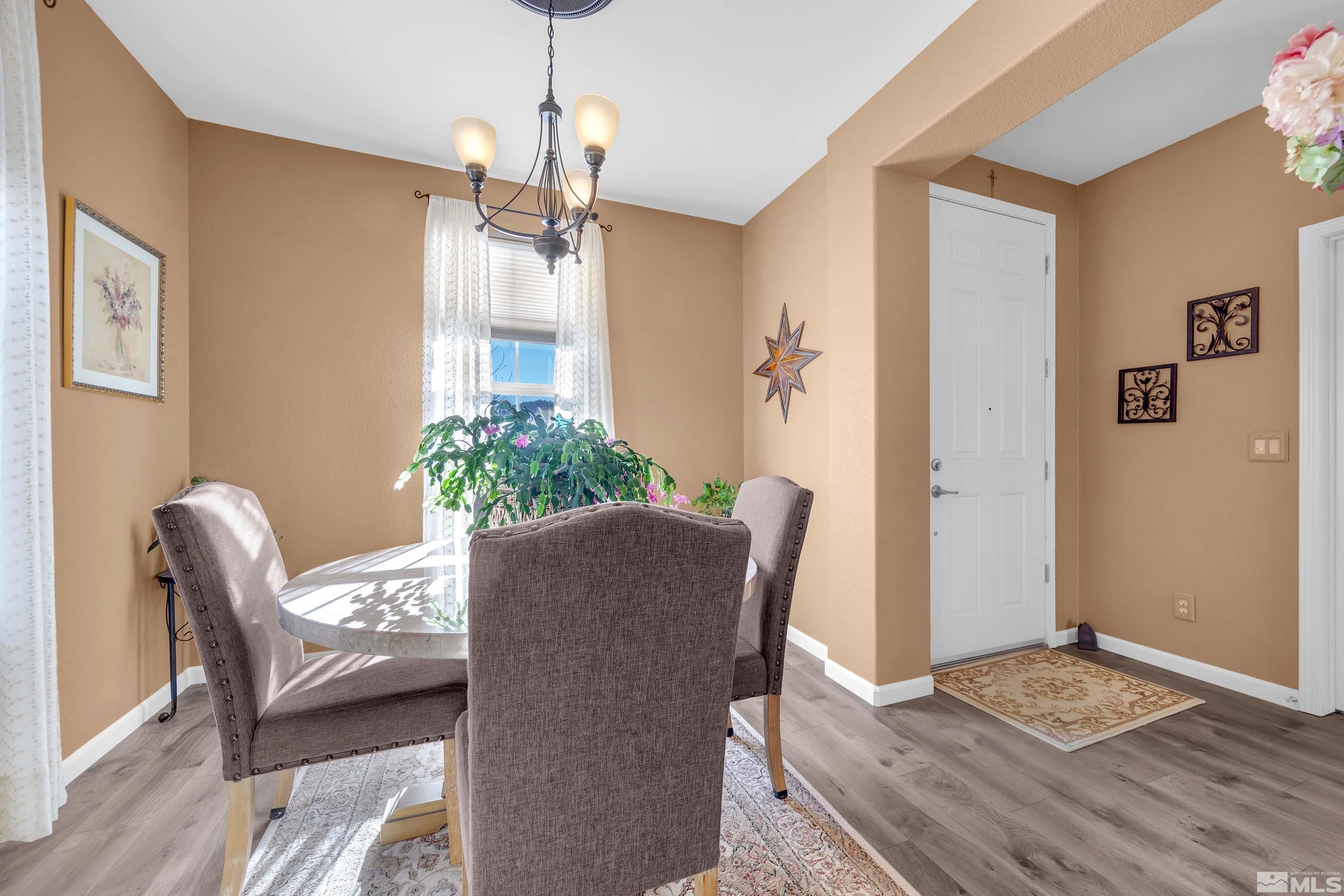 895 Larrimore Trail Reno, NV 89523 - Photo 14 of 39 a dining room with furniture and wooden floor