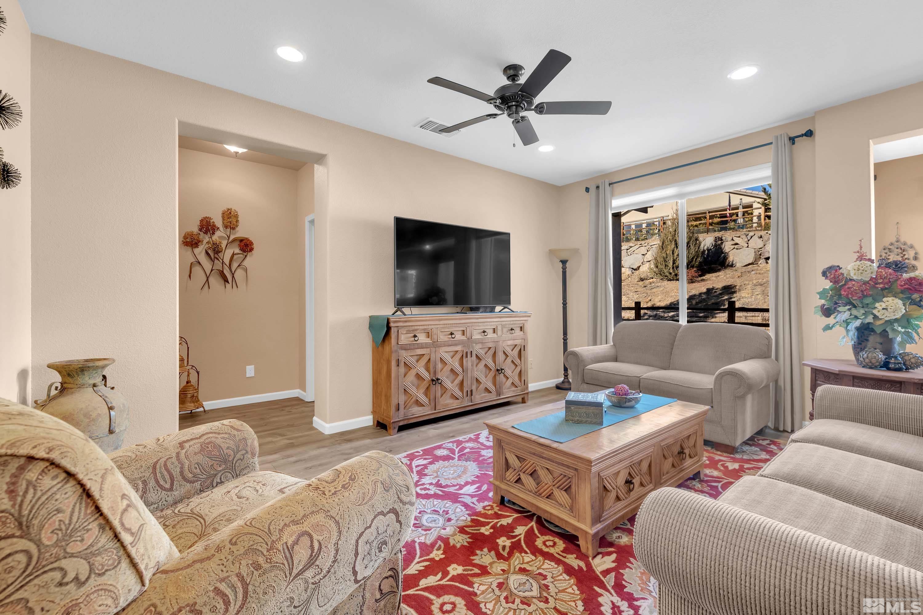 895 Larrimore Trail Reno, NV 89523 - Photo 21 of 39 a living room with furniture and a flat screen tv